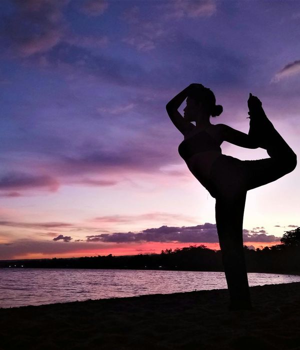 Woman in a graceful yoga pose, finding harmony and balance.